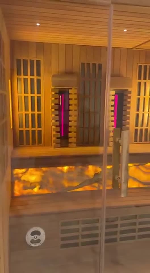 Finished sauna room after renovation in Bali, with backlit salt panels and digital controls